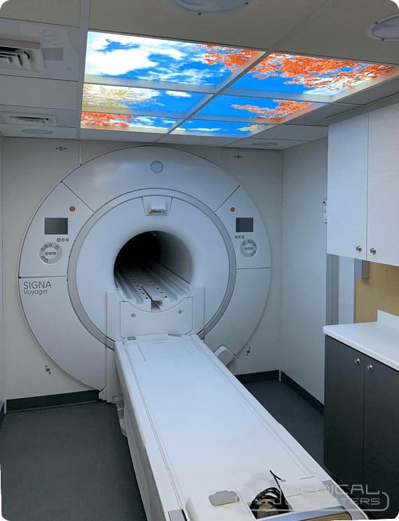 A 1.5T MRI installed by Medical Outfitters in a compact suite with a backlit sky ceiling