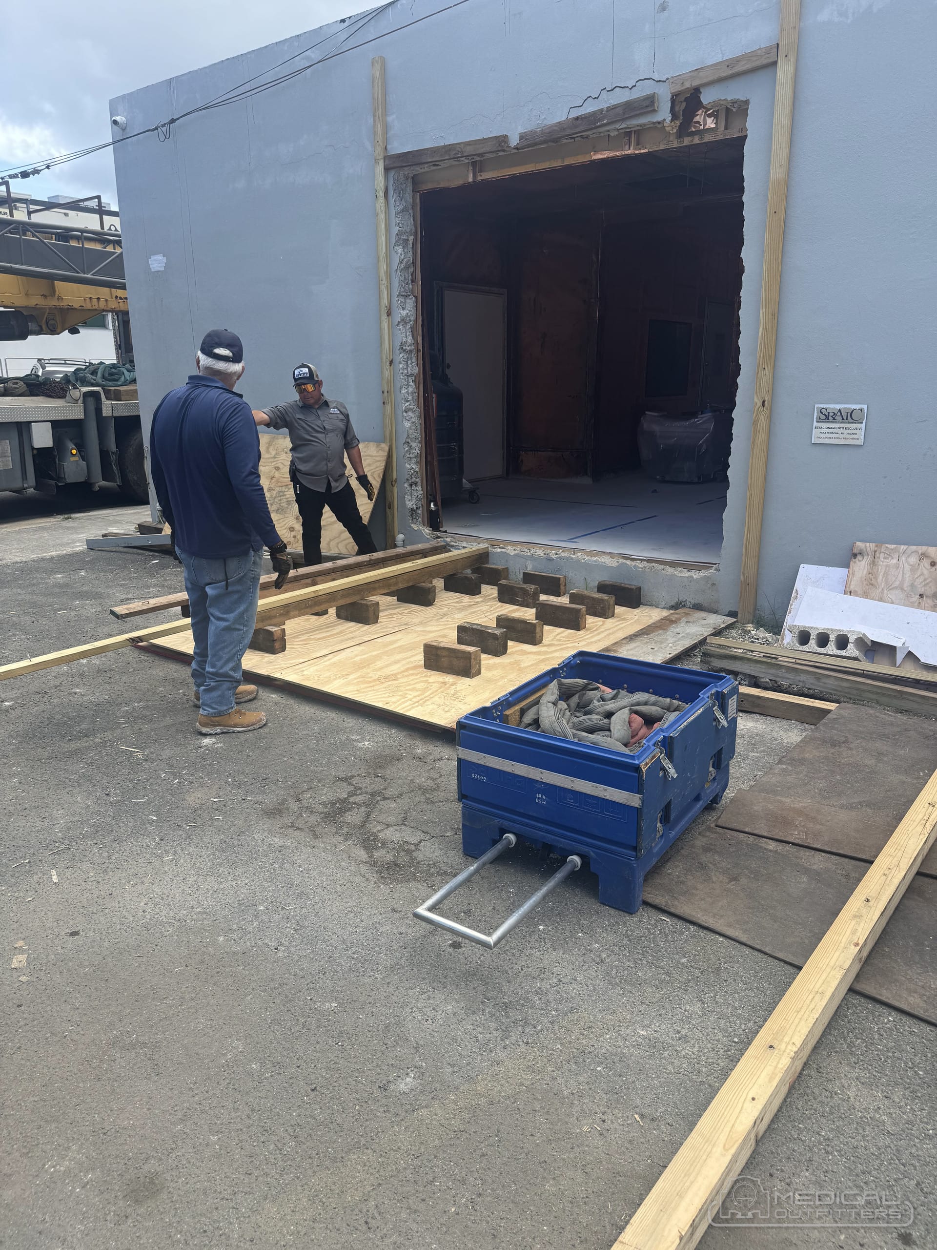 Medical Outfitters crew preparing the magnet room opening and base plates before an MRI is rigged in