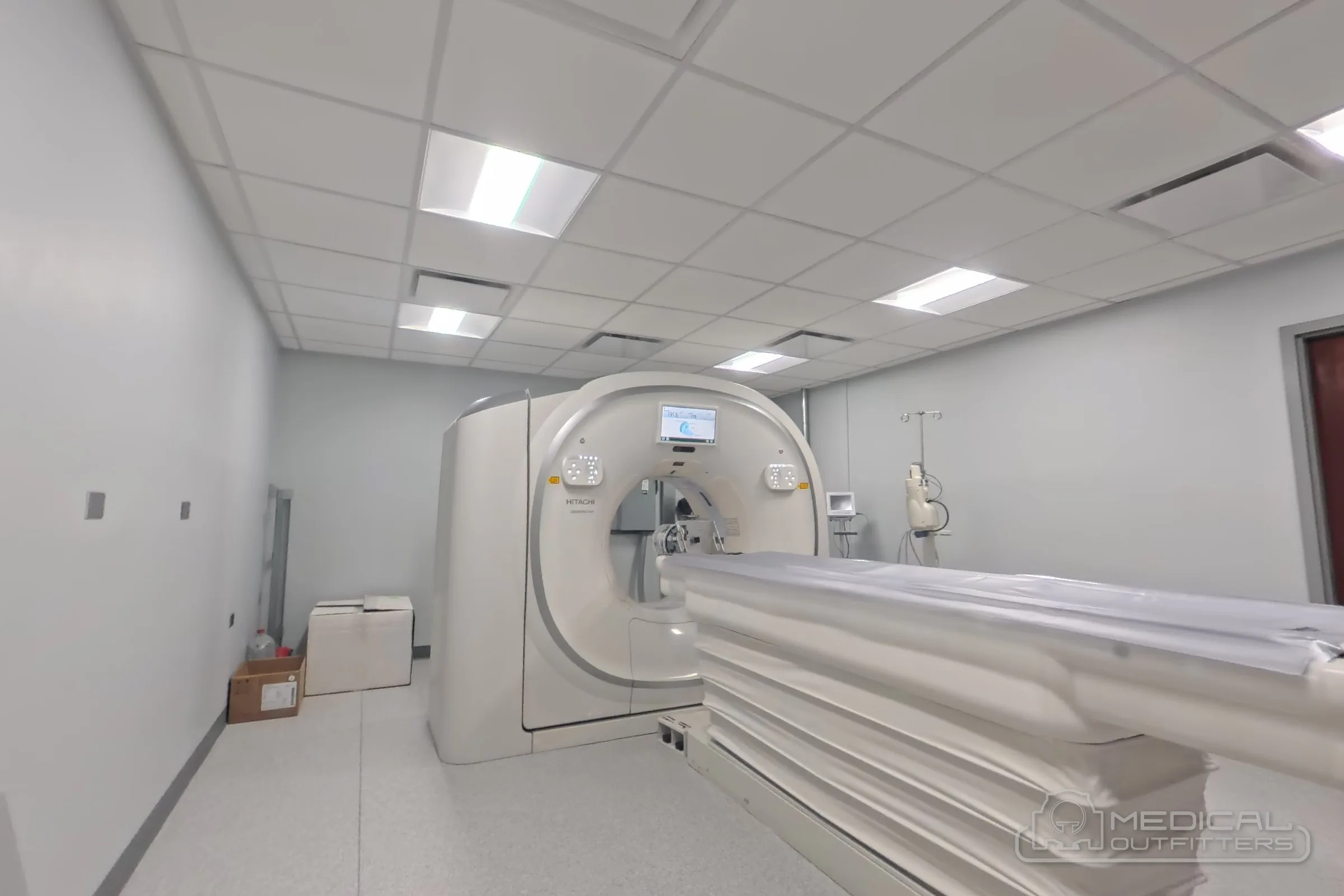 Side view of a Fujifilm CT scanner installed by Medical Outfitters in a finished CT suite
