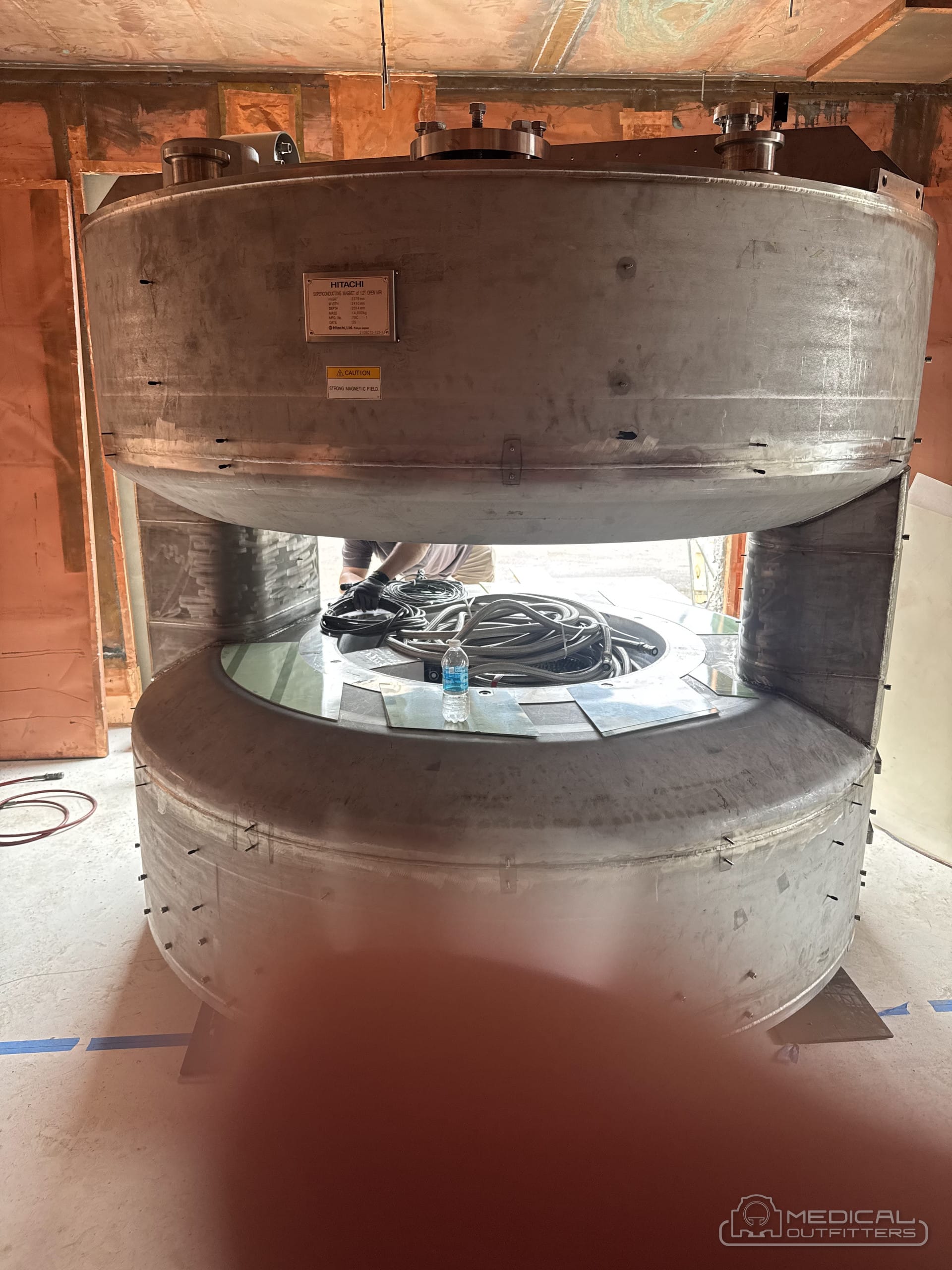 MRI magnet cryostat set inside the copper RF-shielded room before covers and finishes, Medical Outfitters installation