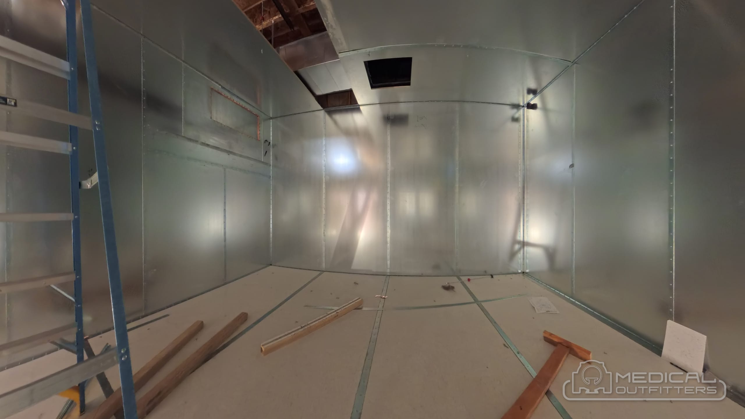 RF shield panels being installed on the walls and ceiling of an MRI room on a Medical Outfitters project