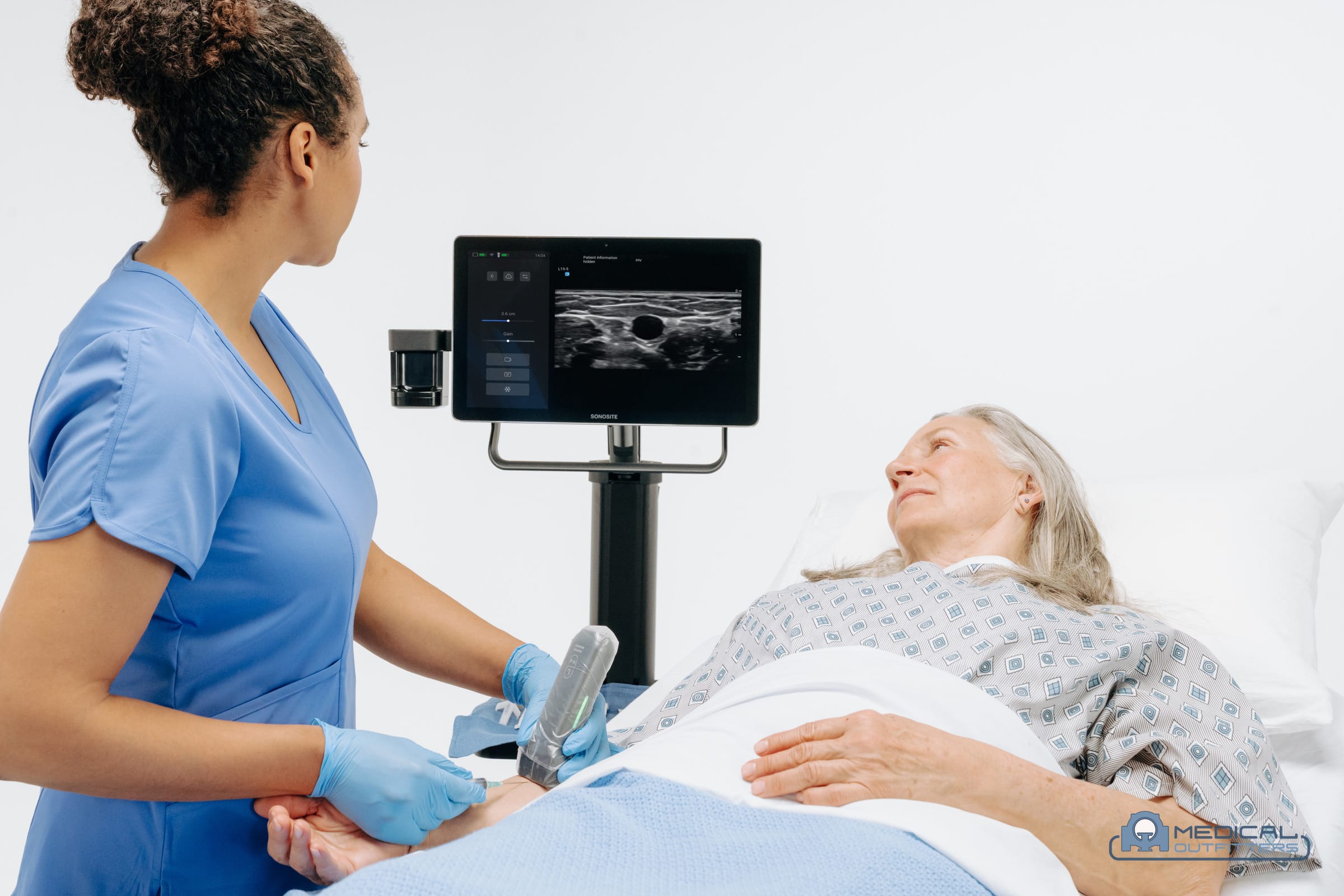 Nurse using a Fujifilm Sonosite iLook ultrasound for vascular access at a patient's bedside, photo courtesy of Fujifilm Sonosite, with the Medical Outfitters watermark