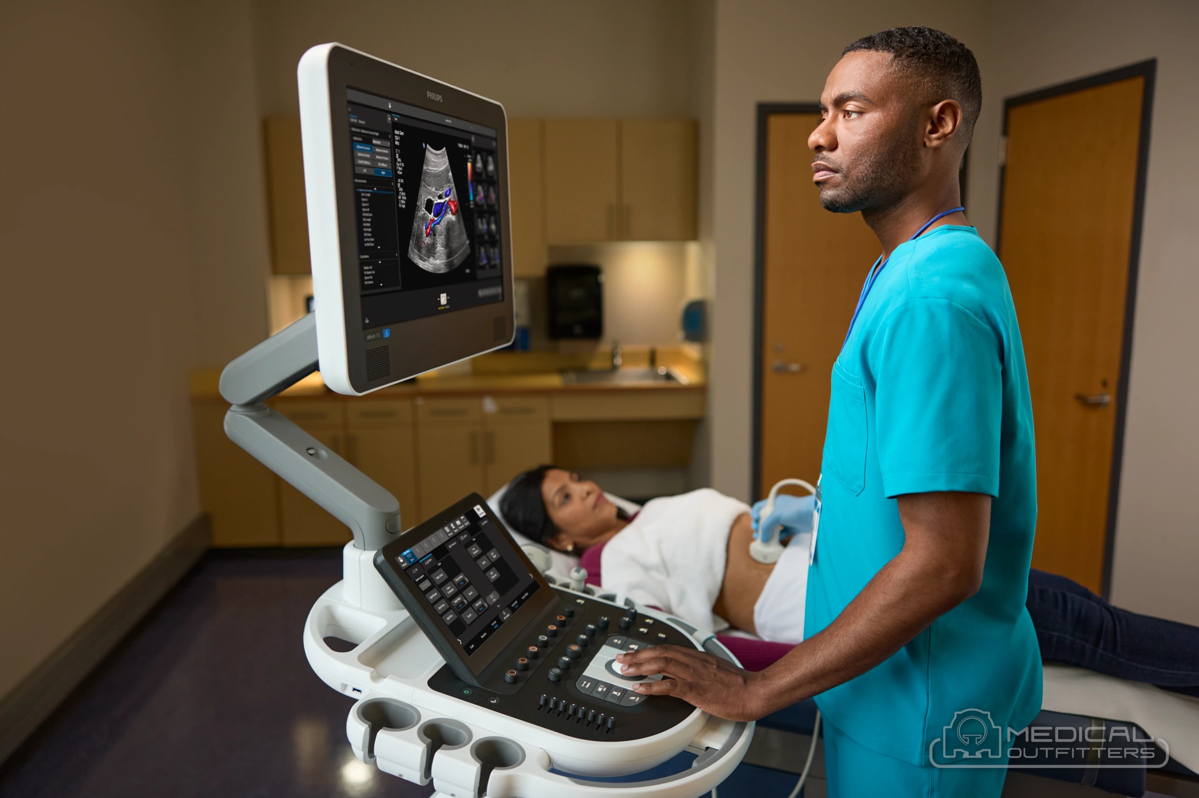 Sonographer scanning a patient at a Philips Affiniti 70 ultrasound cart, photo courtesy of Philips, with the Medical Outfitters watermark