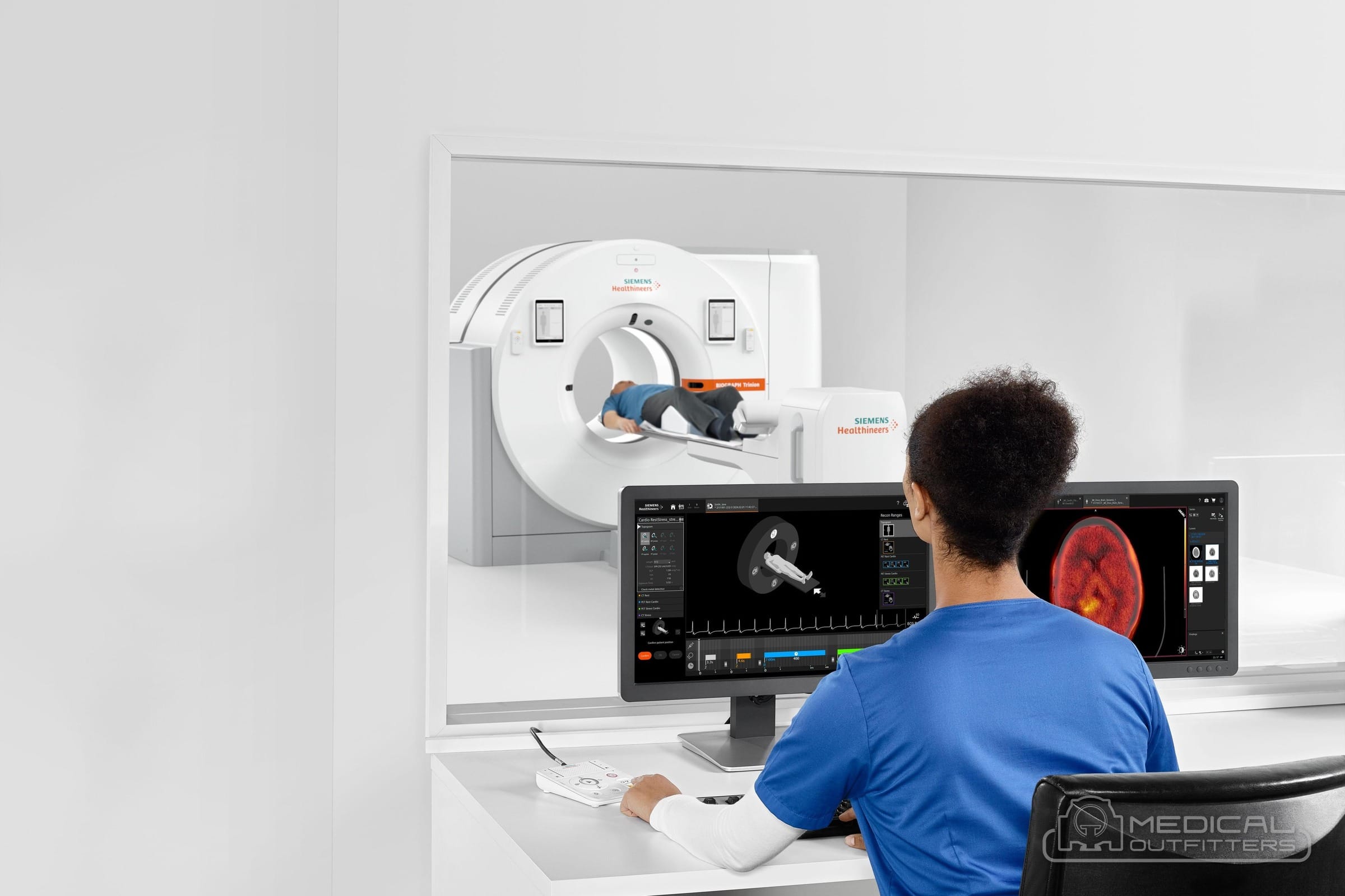 Technologist at the acquisition workstation in the control room of a Siemens Biograph Trinion PET/CT scanner, photo courtesy of Siemens Healthineers