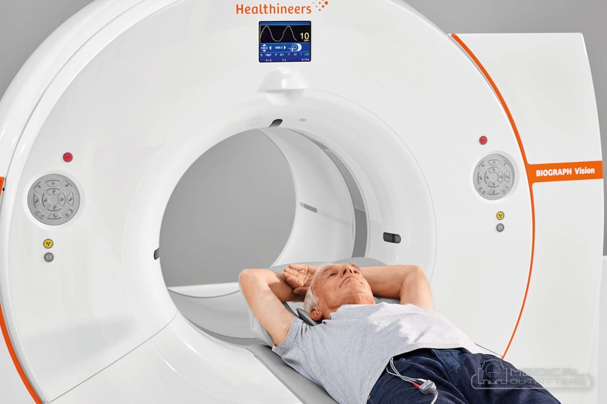Patient positioned in the bore of a Siemens Biograph Vision PET/CT scanner, photo courtesy of Siemens Healthineers, with the Medical Outfitters watermark